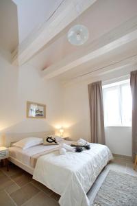 Postel nebo postele na pokoji v ubytování Apartments Rita