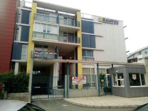 an apartment building with a sign in front of it at Studios in Complex Elit 4 in Sunny Beach