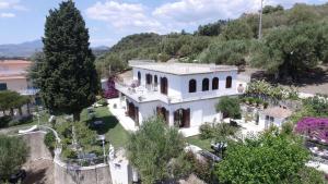 an aerial view of a white house with trees at Il Paradiso Di Hyele in Ascea