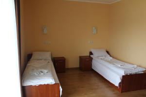 Кровать или кровати в номере Sukhoviia