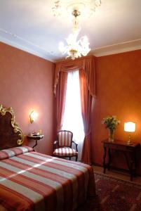 Postel nebo postele na pokoji v ubytování Hotel Ateneo