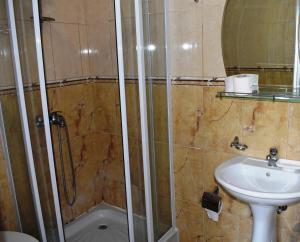 a bathroom with a shower and a sink at Bisha Apartments in Ulcinj +33 photos