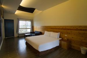 Postel nebo postele na pokoji v ubytování Kenting Xia Ye B&B
