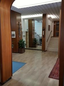 an office lobby with a hallway with a staircase at Hotel Residence Adriana in Cesenatico