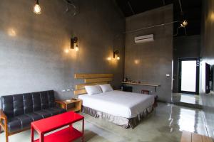 Postel nebo postele na pokoji v ubytování Kenting Xia Ye B&B