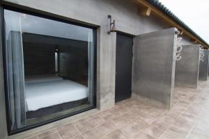 Postel nebo postele na pokoji v ubytování Kenting Xia Ye B&B