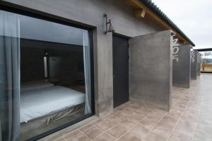 Postel nebo postele na pokoji v ubytování Kenting Xia Ye B&B