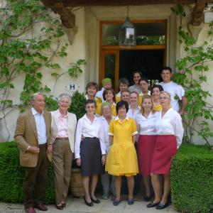 a group of people standing in front of a house at Villa Le Barone in Panzano