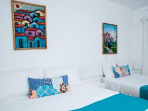 Postel nebo postele na pokoji v ubytování Hotel Neptuno Refugio