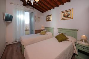 Posteľ alebo postele v izbe v ubytovaní Casa di Campagna Pianelli + 32 fotografií