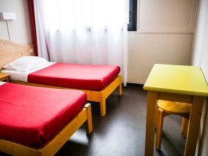 Postel nebo postele na pokoji v ubytování Village Vacances Passion L'Estibère