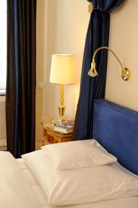 Postel nebo postele na pokoji v ubytování Boutique Hotel Splendid