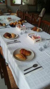 a long table with plates of food on it at Hotel la Masia in Portbou