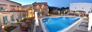 a view of a swimming pool at a hotel at Issalos Studios in Skala Potamias