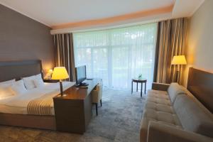 Łóżko lub łóżka w pokoju w obiekcie HAVET Hotel Resort & Spa