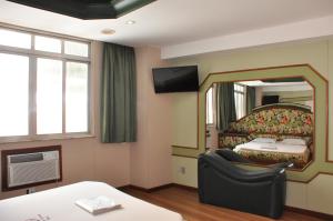 Postel nebo postele na pokoji v ubytování Hotel Barão do Flamengo (Adult Only)