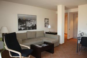 a living room with a couch and a table at Apartamentos La Fonda in Cardona