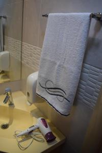 a towel hanging on a towel rack in a bathroom at Apartment Dunja Konaci in Kopaonik +50 photos