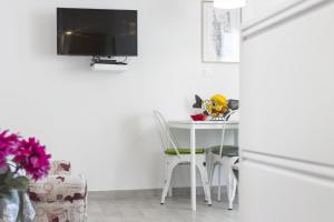 TV a/nebo společenská místnost v ubytování FM Apartments