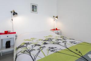 Postel nebo postele na pokoji v ubytování FM Apartments