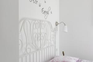 Postel nebo postele na pokoji v ubytování FM Apartments