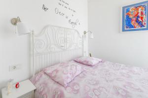 Postel nebo postele na pokoji v ubytování FM Apartments