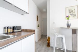 Kuchyň nebo kuchyňský kout v ubytování FM Apartments