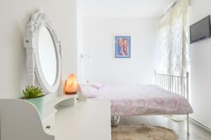 Postel nebo postele na pokoji v ubytování FM Apartments