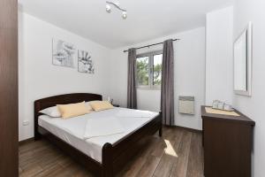 Postel nebo postele na pokoji v ubytování Apartmani Iva