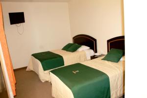 A bed or beds in a room at Hotel Meflo Chachapoyas