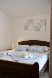 Postel nebo postele na pokoji v ubytování Apartmani Iva