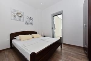 Postel nebo postele na pokoji v ubytování Apartmani Iva