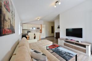 TV a/nebo společenská místnost v ubytování Apartmani Iva