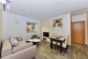 TV a/nebo společenská místnost v ubytování Apartmani Iva
