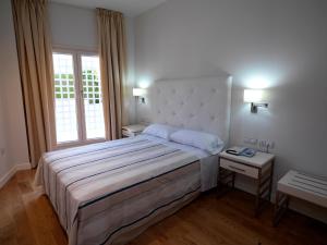 Postel nebo postele na pokoji v ubytování Hotel Atlántico