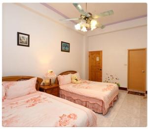 Posteľ alebo postele v izbe v ubytovaní Yilan Xiang Feng Homestay