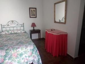 Postel nebo postele na pokoji v ubytování Hostal Gran Capitan