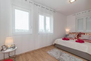 Postel nebo postele na pokoji v ubytování Apartments Radica