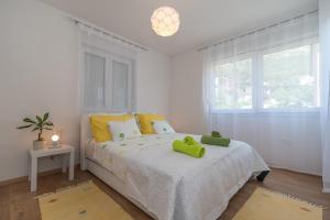 Postel nebo postele na pokoji v ubytování Apartments Radica