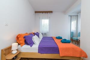 Postel nebo postele na pokoji v ubytování Apartments Radica