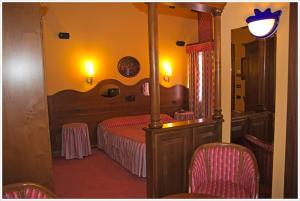 Postel nebo postele na pokoji v ubytování Hotel California + 10 fotografií