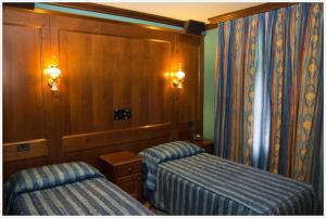 Posteľ alebo postele v izbe v ubytovaní Hotel California