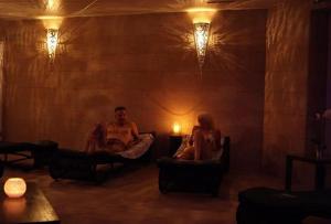 a man and a woman sitting on a couch in a room at Wellness Hotel Aquafit Sursee in Sursee