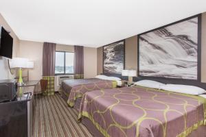 Voodi või voodid majutusasutuse Super 8 by Wyndham Columbus Airport toas