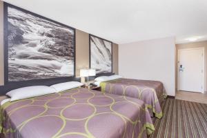 Voodi või voodid majutusasutuse Super 8 by Wyndham Columbus Airport toas