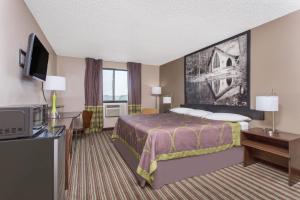 Voodi või voodid majutusasutuse Super 8 by Wyndham Columbus Airport toas