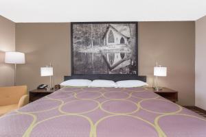 Voodi või voodid majutusasutuse Super 8 by Wyndham Columbus Airport toas