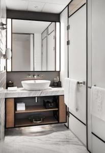 a bathroom with a sink and a mirror at JEN Beijing by Shangri-La in Beijing
