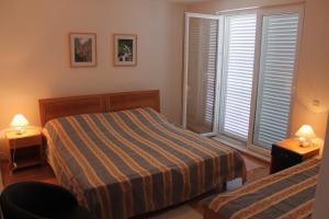 Postel nebo postele na pokoji v ubytování Bed & Breakfast Dora