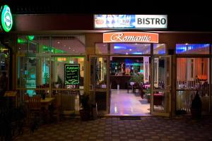 an entrance to a restaurant at night at Hotel Romantic in Byala